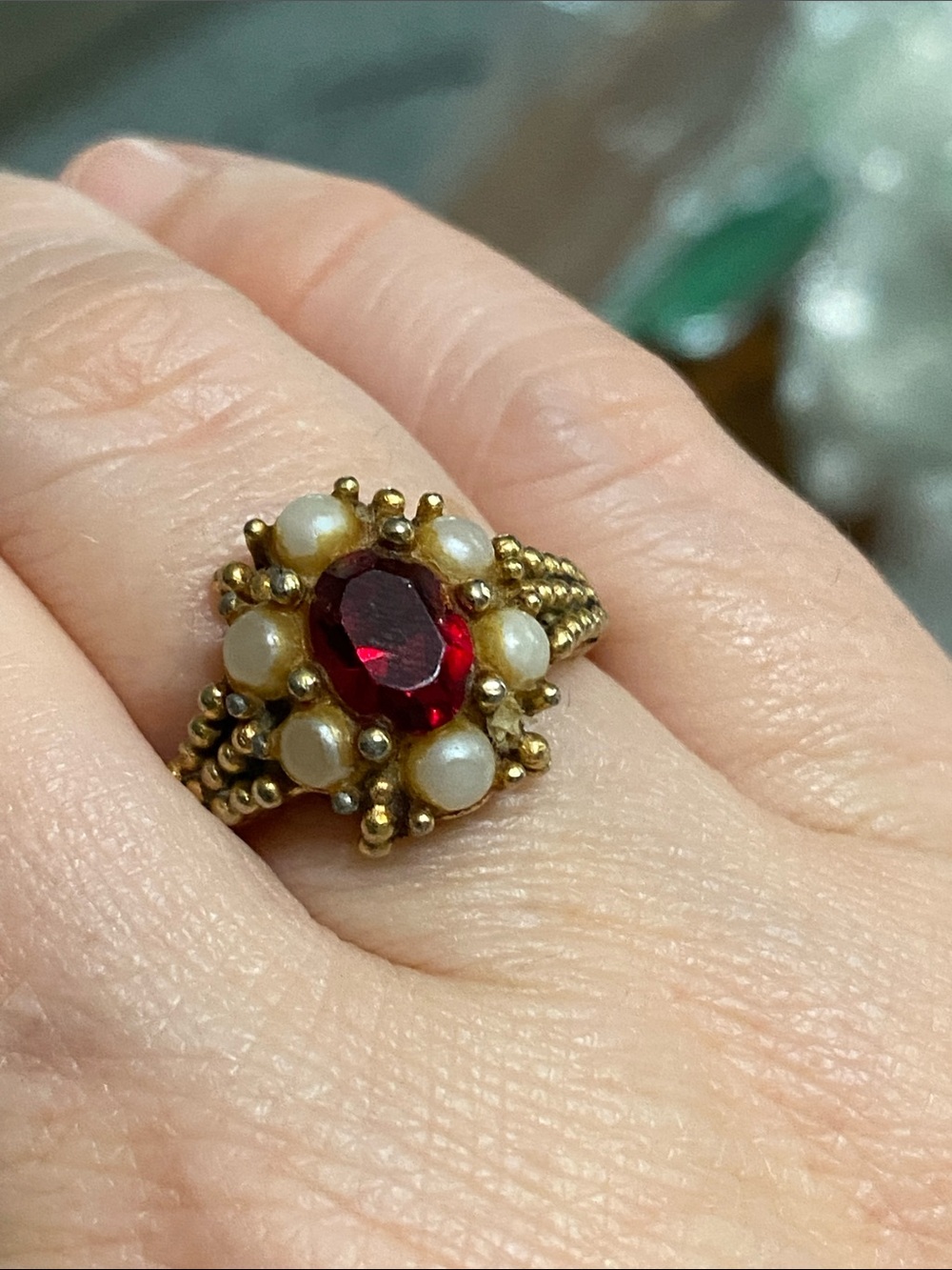 Gold Pearl Halo Ring with Red Center Stone